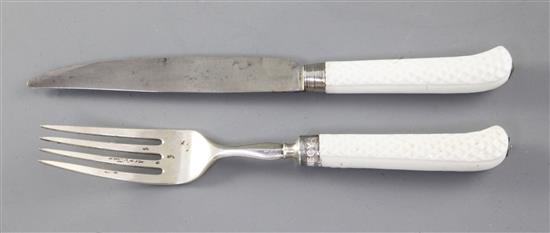 A Saint Cloud or Mennecy white glazed porcelain pistol handled knife and fork, c.1740-60, 21cm and 22.5cm